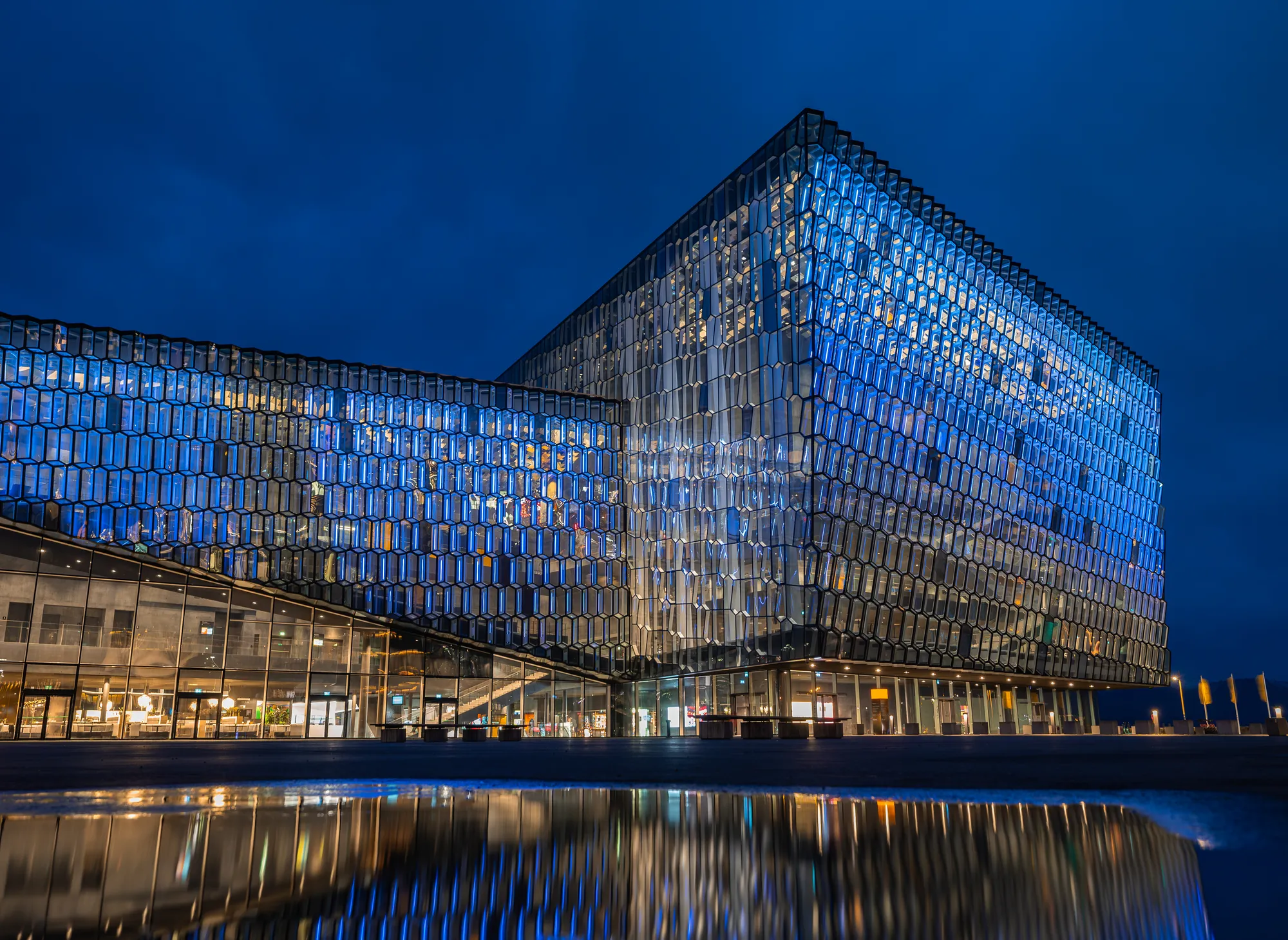 Harpa Concert Hall at blue hour — home of Volcano Express and its live earthquake monitor