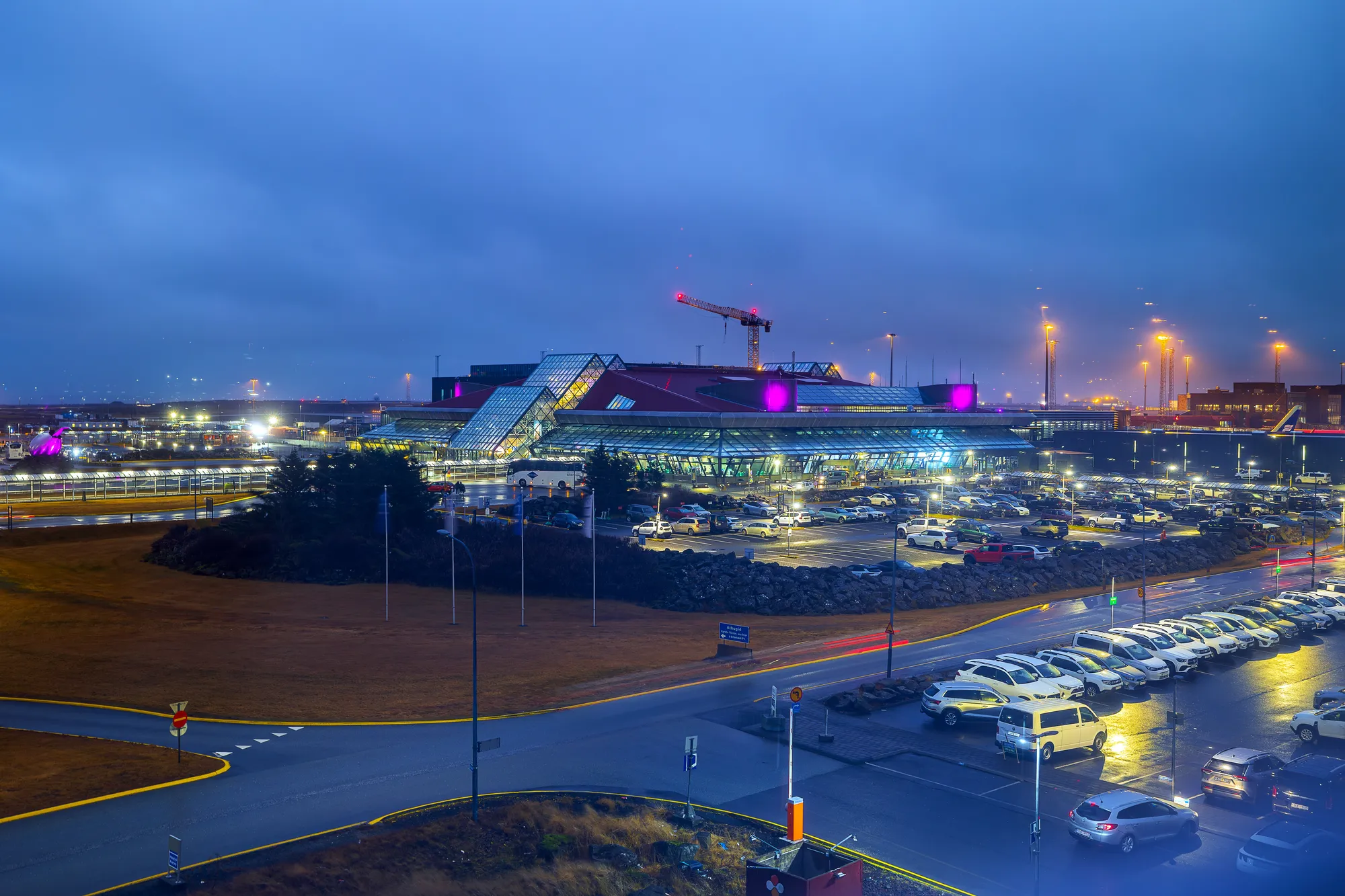 Keflavík International Airport terminal at dusk, the arrival point for nearly all visitors to Iceland