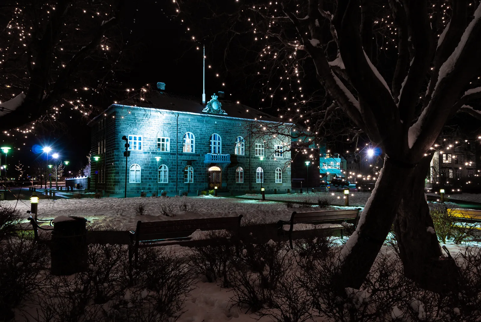 The Parliament building and Austurvöllur square in Christmas lights — December is Reykjavík's most decorated month