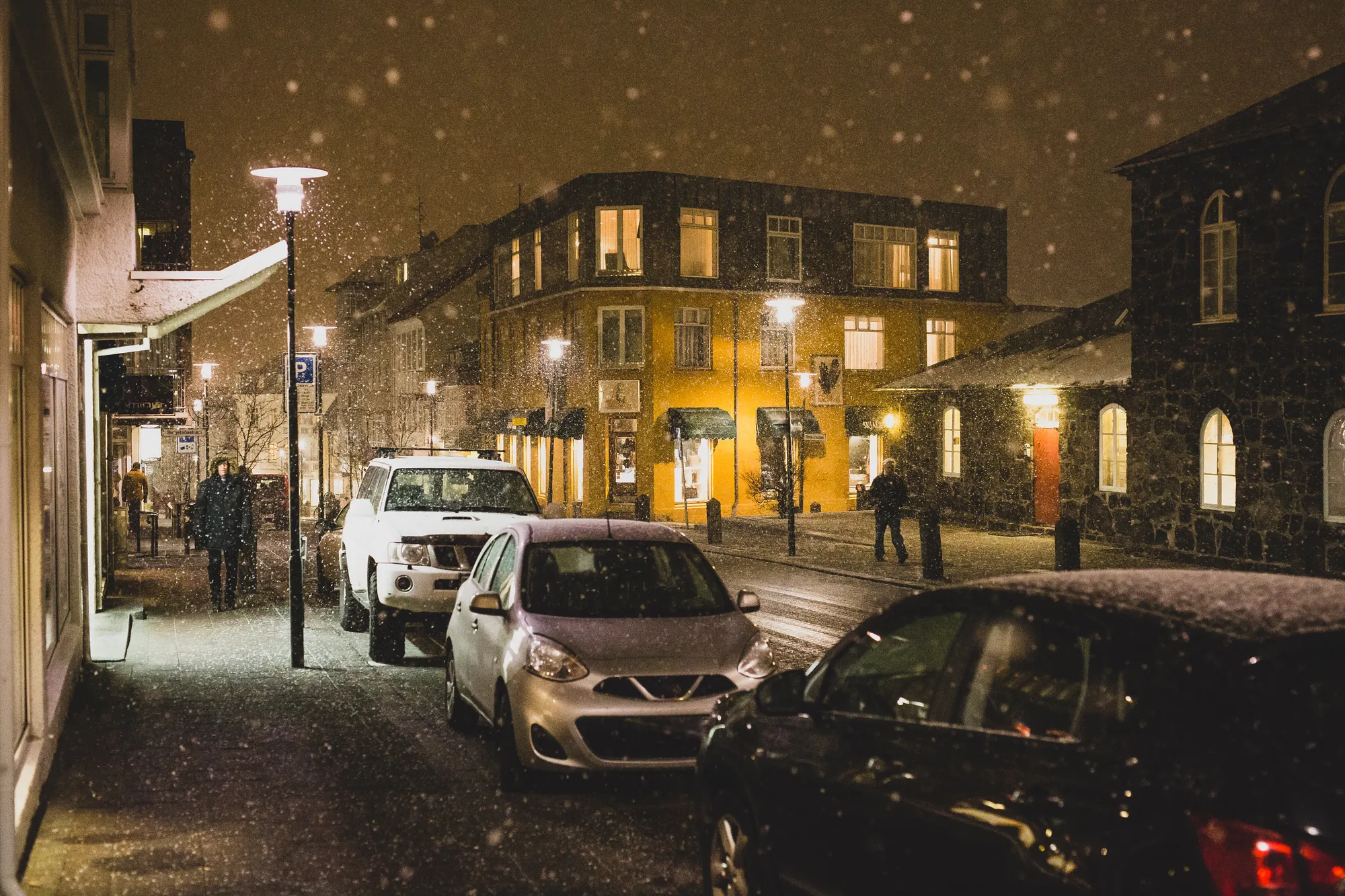 Snowy downtown Reykjavík on a December evening — the city's long, lit-up dark hours