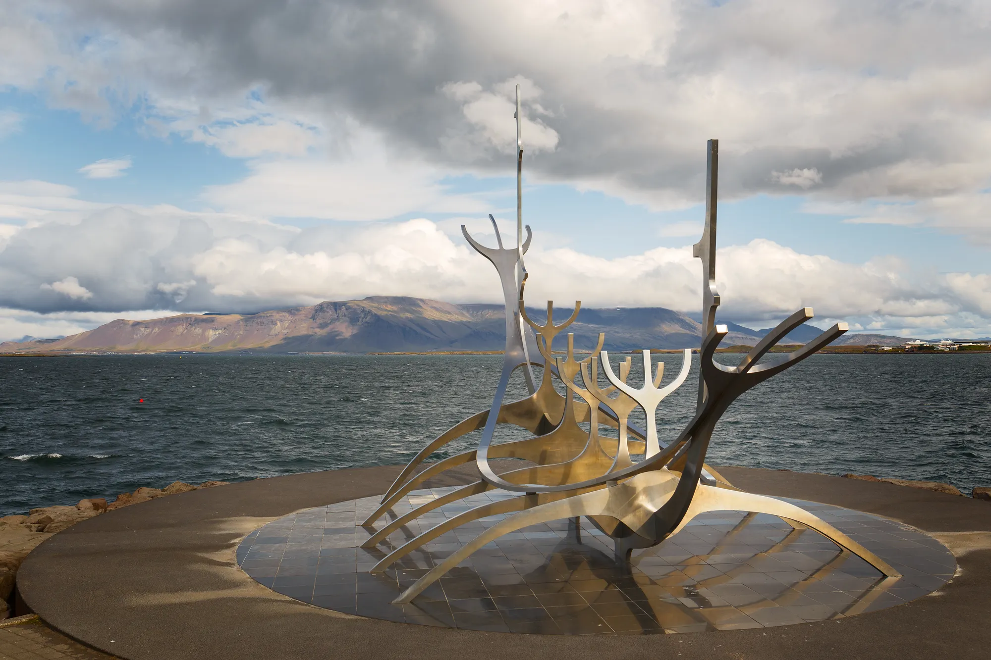 The Sun Voyager sculpture with Mount Esja across the bay — a free 25-minute waterfront walk from Harpa