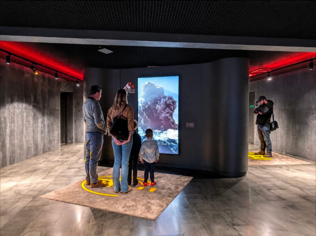 Interactive exhibition screens in the Volcano Express pre-show area, included with every ticket
